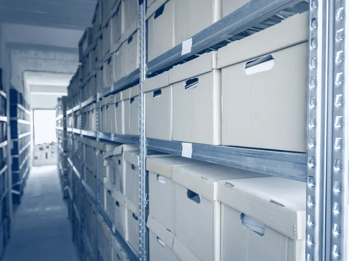 Document boxes filling archive shelving